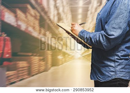 Business Logistics Concept, Businessman Manager Taking Notes During Check And Control In Warehouse -