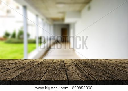 Wooden Brown Table Top Against The Blurred Corridor, Passage And Courtyard Of The House .for Product