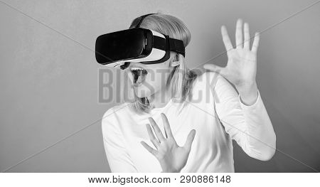 Confident Young Woman Adjusting Her Virtual Reality Headset And Smiling. Excited Smiling Businesswom