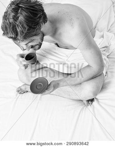 Guy Having Coffee While Sit Bed In Bedroom Or Hotel Room. Man Bearded Handsome Guy Eating Breakfast 