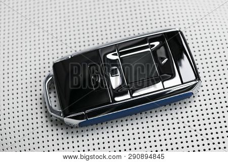 Closeup Inside Vehicle Of Wireless Blue Leather Key Ignition On White Leather Seat. Wireless Start E