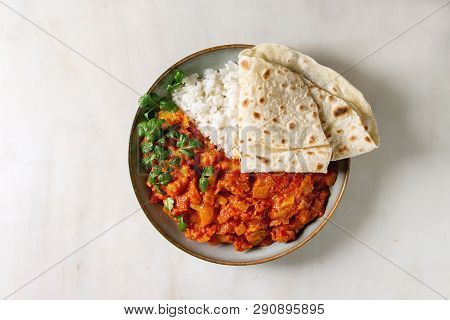 Vegan Vegetarian Curry With Ripe Yellow Jackfruit Served In Ceramic Bowl With Rice, Coriander And Ho