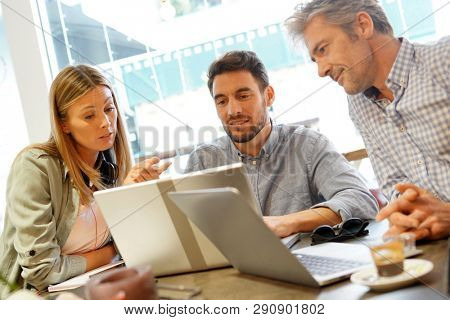 Colleagues igoing over pitch in coworking space