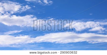 Many White Clouds On Blue Sky In Spring