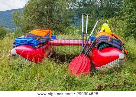 Water Trip On A Catamaran On A Dniester River. Red Catamarans Close-up.