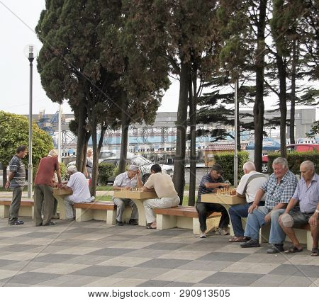 Tuapse, Russia - March 22, 2019: Unidentified Elderly Men Play Chess In A Park