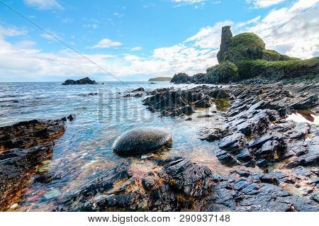Jagged Rock Layers And Boulders Smoothed By The Ocean Are Seen At An Intertidal Zone On The Island O
