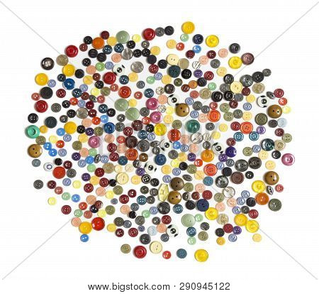 Semifinished For Background - Multicolored Plain Buttons Chaotically Arranged On A White Surface