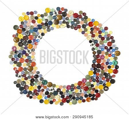Semifinished For Background With Round Frame - Multicolored Plain Buttons Chaotically Arranged On A 
