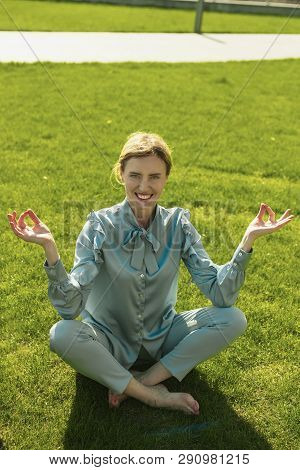 Lucky Nice Lady Doing Yoga On Grass