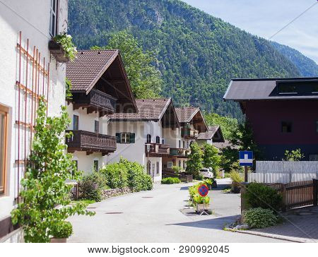 An Old, Vintage, Wooden House Is Located In The Alps