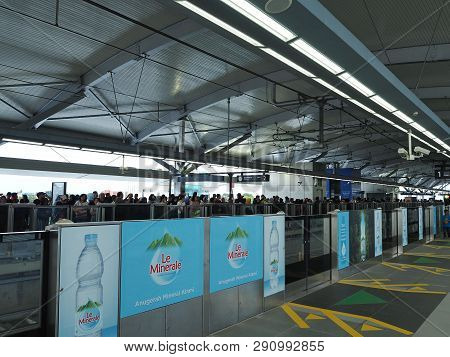 Jakarta, Indonesia - March 23, 2019: Crowd Of People Standing On The Platform Waiting For The Train 