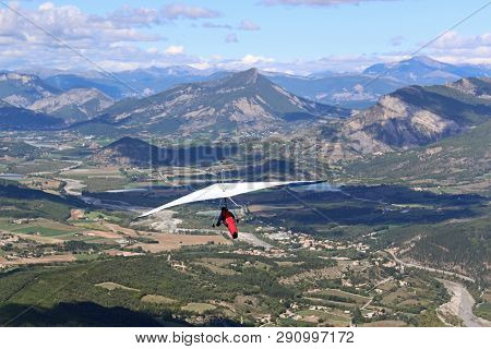 Hang Glider Flying From The Chabre Mountain, France