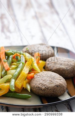 Beef Meatballs And Vegetables Salsd Wood Background