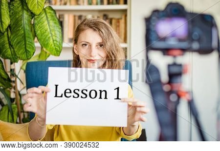 teacher or vlogger recording a lesson on camera online learning