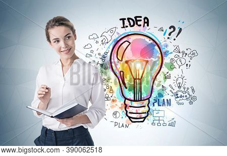 Beautiful Young Businesswoman With Clipboard Standing Near Grat Wall With Business Idea Sketch Drawn