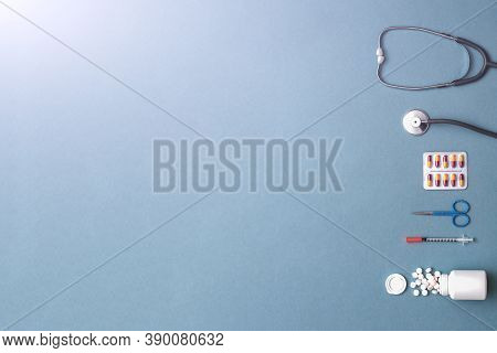Pills, Ampoule, Syringes, Capsules, Stethoscope On The Blue Doctor S Table. Copy Space. Place For Te
