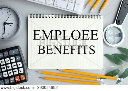 Emploee Benefits, Text On Notebook On Gray Background Near Magnifier, Pencils, Plant, Keyboard