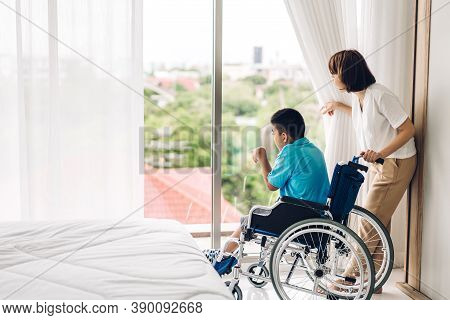 Portrait Of Enjoy Happy Love Family Asian Mother Playing And Carer Helping Look At Disabled Son Chil