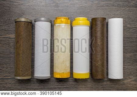 Old And New Filter Cartridges For Water. New And Used Blocks Filters For Cleaning Water In Equipment