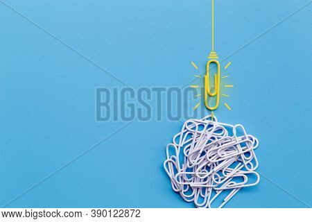 Great Ideas Concept With Paperclip,thinking,creativity,light Bulb On Blue Background,new Ideas Conce