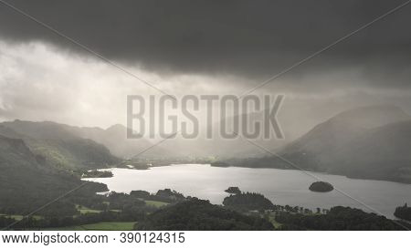 Beautiful Landscape Image Across Derwentwater Valley With Falling Rain Drifting Across The Mountains