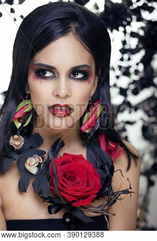 Pretty Brunette Woman With Rose Jewelry, Black And Red, Bright Make Up Kike A Vampire Closeup Red Li