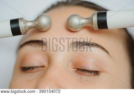 Top Macro Close Up View Of Women Facial Massage Spa Procedure. Electric Stimulation Facial Skin Care