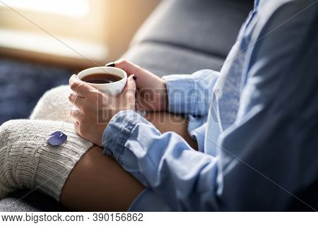 Cold Winter Morning Comfort At Home With Warm Tea. Happy Woman Holding Hot Cup. Sick Person With Flu