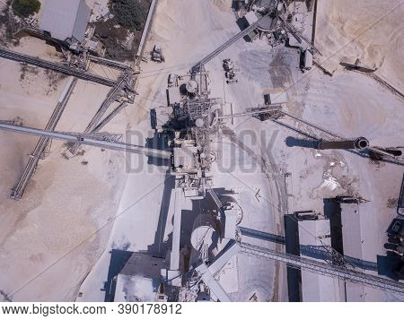 Large Quarry Stone Sorting Conveyor Belts And An Open Pit Mine.