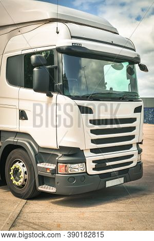 Close Up For Cab Of A Lorry With A View Of Big Tyre In Sunny Day