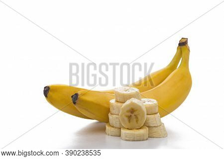 Ripe Bananas And Banana Slices Isolated On White Background