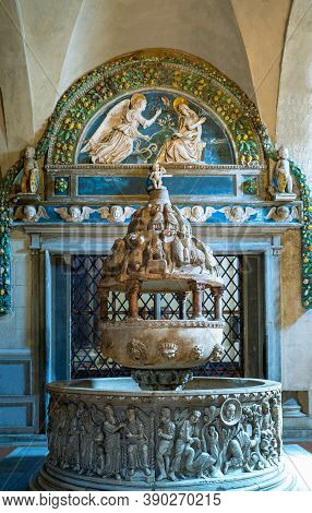 Lucca, Italy - June 5, 2018:   San Frediano Basilica, The Marble Baptismal Font Under The  Work In V