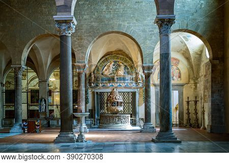 Lucca, Italy - June 5, 2018:   San Frediano Basilica, The Marble Baptismal Font Under The  Work In V