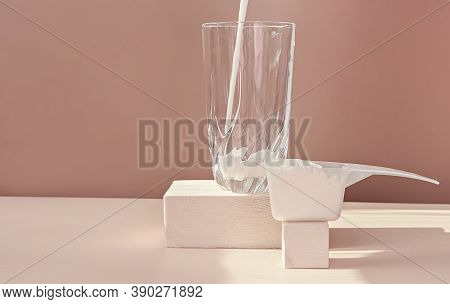 Cold Protein Milkshake Smoothie Drinkpouring In A Glass. Collagen Drink Unflavored On Wooden Pedesta