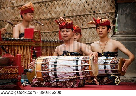Denpasar, Bali Island, Indonesia - June 23, 2016: Group Of Balinese People. Beautiful Men In Colorfu