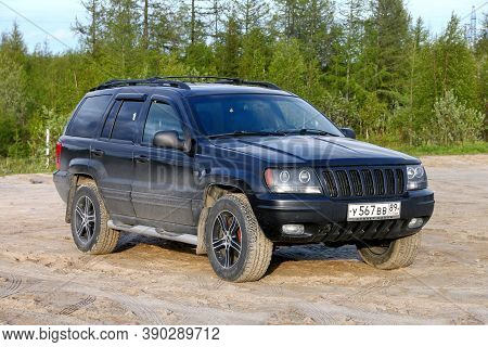 Novyy Urengoy, Russia - June 3, 2020: Black American Suv Jeep Grand Cherokee Wj At The Countryside.