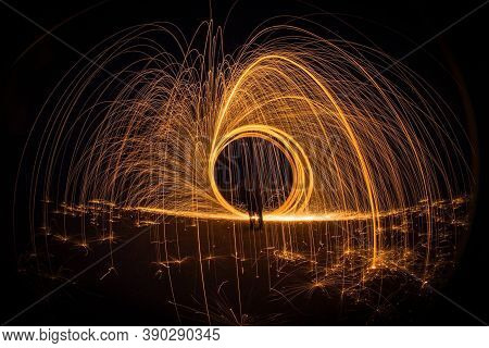 Fireworks form a circle until they fall to the ground for the New Year\\\'s celebrations