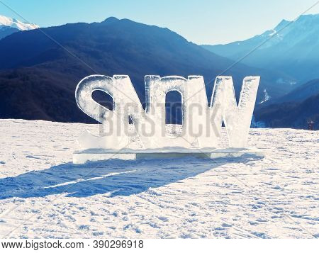 Icy Inscription Snow Stands On The Snow In A Mountain Valley