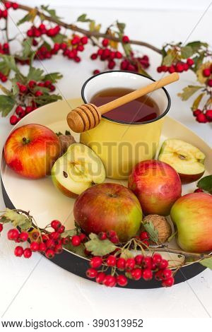Cozy Autumn Hot Tea With Honey, Apples And Red Hawthorn Berries On A Tray. Still Life On White Backg