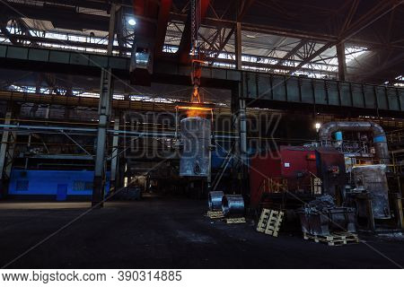 Iron Casting And The Foundry. Overhead Crane With Ladle With Molten Metal At Metallurgical Factory