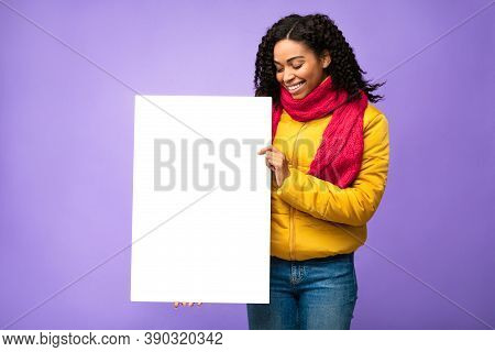 Black Lady Showing Blank White Poster Posing With Blank Paper Board Advertising Winter Offer Standin