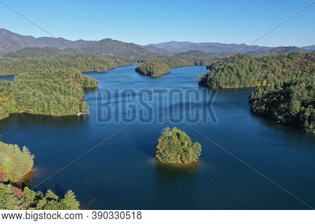 Aerial View Of Lake Santeetlah, North Carolina And Surrounding National Forests In Autumn Color.