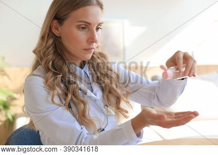 Medical Specialist Disinfecting Hands With Hand Rub Antiseptic.
