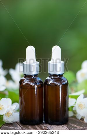 Essential Jasmine Oil. Bioproduct, Organic Cosmetics. Perfumery, Cosmetology, Aromatherapy