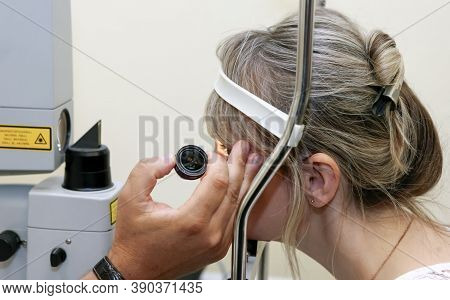 Woman Unergo Eyes Test. Ocular Fundus. Visit To The Doctor.