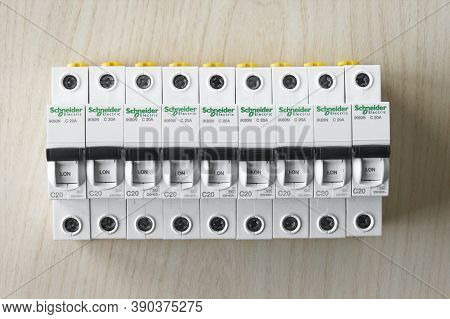 Kharkov, Ukraine - September 22, 2020 : Schneider Electric Circuit Breakers On Light Wood Background