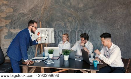 Angry Boss Reprimanding Employee For Bad Work Result Sitting At Conference Table, Male Ceo Scolding 