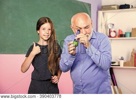School Education. Biological Sample. Mature Teacher Look Through Magnifying Glass Tube On Lime. Smal