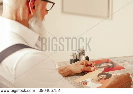 Photographer Looking Her Pictures For Work. Man Is Sad And Depressed For Her Ex Girlfriends. Single 